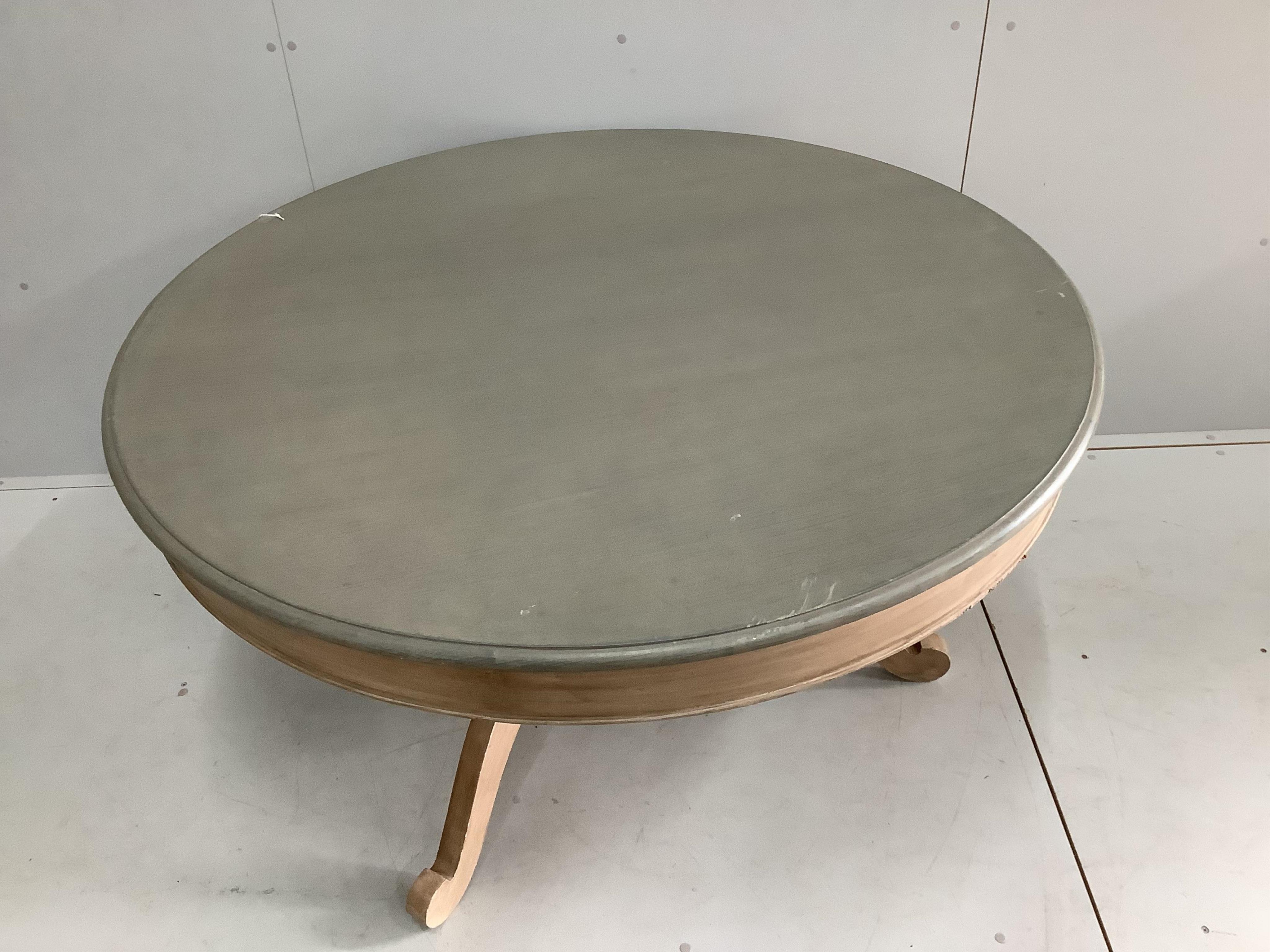 An Oka Furniture 'Arthur' circular table, diameter 130cm, height 74cm and six Oka French style limed oak chairs. Condition - good